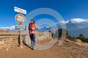 Young traveller trekking in Poon Hill view point in Ghorepani, Nepal