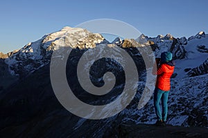 Young trekker woman enjoying the Ortler Alps near Sulden on a sunny October day.