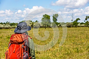 Young trekker woman with rucksack