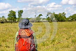 Young trekker woman with rucksack