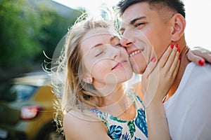 Young trendy beautiful couple dating outdoors in city