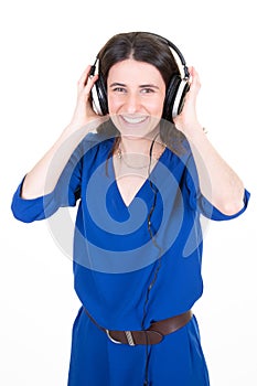 Young trendy beautiful singer teenager girl with headphones on white background singing