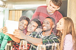 Young trendy friends drinking wine inside fashion winery bar - Happy millennials people having fun and laughing together in pub