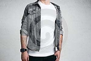 Young trendy guy wearing white blank t-shirt and jacket