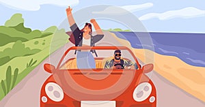 Young trendy happy hipster couple in love having trip along country road by red cabriolet. Laughing dancing stylish girl