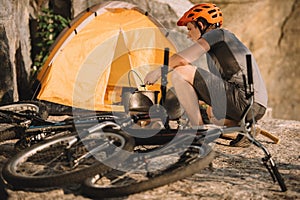 young trial biker at camping