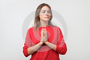 Young tricky woman having something in mind photo