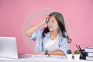 Young troubled confused puzzled employee business director woman in casual shirt sit work at white office desk with pc laptop