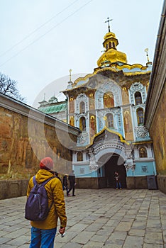 Young turist looking on old church