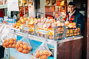 Young Turkish boy selling fruits