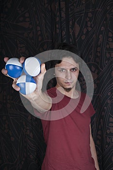Young turkish guy playing juggling balls