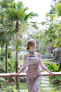 Young ukraine girl at luxury resort villa on a tropical Bali island, Indonesia.