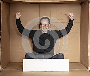 Young unemployed man holding a white board, a place for advertising, the idea of a cry for help