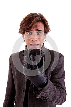 young unhappy businessman looking to phone