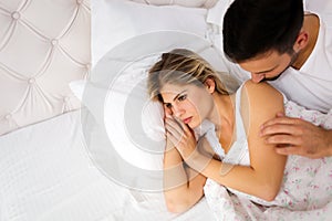 Young unhappy couple having problems in relationship