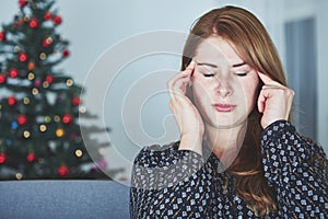 Young unhappy girl has headache