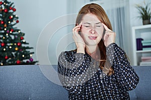 Young unhappy girl has headache