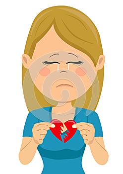 Young unhappy sad woman with a broken heart card