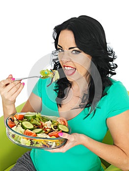 Young Unhappy Woman Eating a Fresh Crisp Mixed Garden Salad