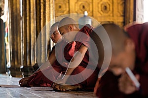 Young unidentified Buddhist monks learning in the Shwe Yan Pyay monastery school