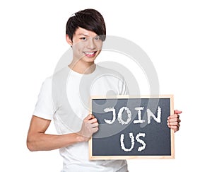 Young university student with blackboard showing a phrases of jo