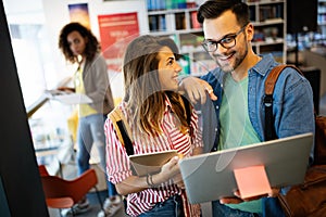 Young university students studying together. Group of multiracial friends in college