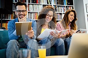 Young university students studying together. Group of multiracial friends in college