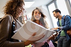 Young university students studying together. Group of multiracial friends in college