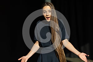 Young unsure female model with long straight hair