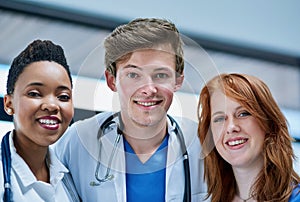 Young and upcoming medical professionals. Portrait of a team of confident young doctors working in a hospital.