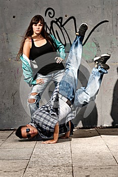 Young urban couple dancers hip hop dancing urban