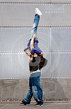 Young urban couple dancers hip hop dancing urban