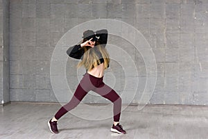 Young urban woman dancing.