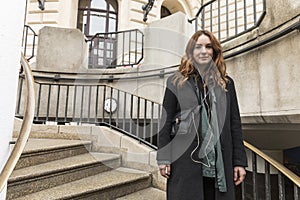 Young Urbanite Woman Walking on Outdoor Staircase photo