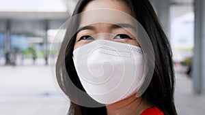 Young vaccinated woman showing arms with adhesive plaster bandage after receiving Covid-19 vaccine injection