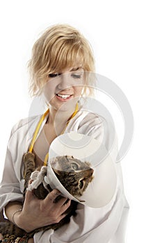 Young veterinarian and cat