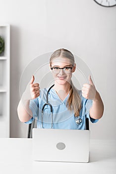 young veterinarian in glasses and blue