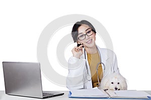 Young veterinarian smiling at camera