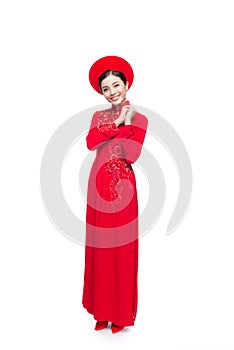 Young vietnamese woman in Ao Dai Dress with praying gesture wish