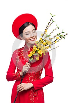 Young vietnamese woman in Ao Dai Dress with praying gesture wish