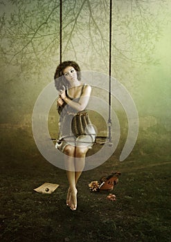 Young violinist on swing