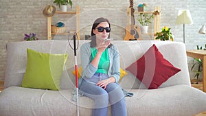 Young visually impaired woman talking on the phone