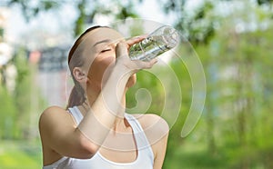 Young vitality woman drinking water photo