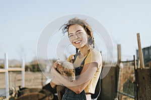 Young volunteer with a piglet, The Sanctuary at Soledad, Mojave photo