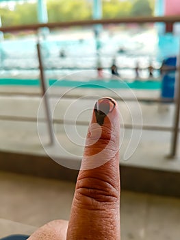 Young voter showing her ink-marked fingers after casting votes near polling booth of east Delhi, India for general Lok Sabha photo