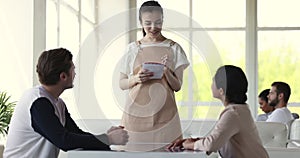 Young waitress in apron serving restaurant guests