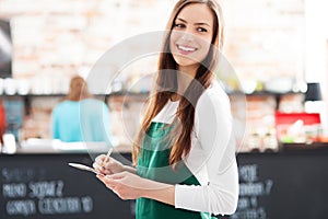 Portrait of waitress in cafe