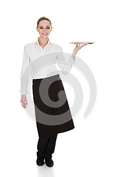 Young waitress holding tray