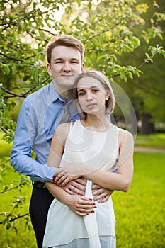 Young wan and woman embracing outdoors