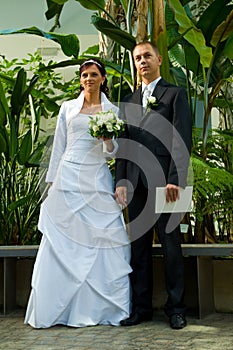 Young wedded couple in garden